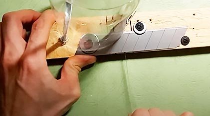 Cut off the top and bottom of the bottle to form a clean cylinder.