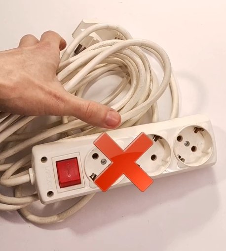 Tangled extension cords on a workbench