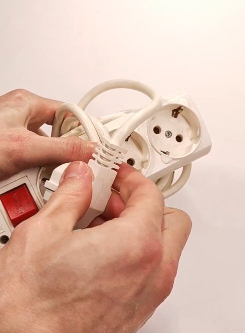 Plugging the extension cord plug into its own socket