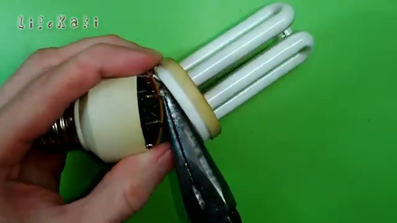 Using pliers to separate the CFL base from the tube