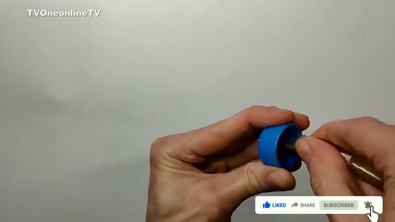 Inserting metal rod into bottle cap for vacuum adapter