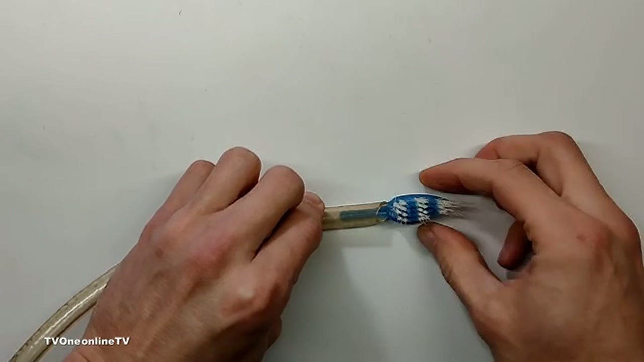 Gluing the toothbrush head to the bottle cap adapter
