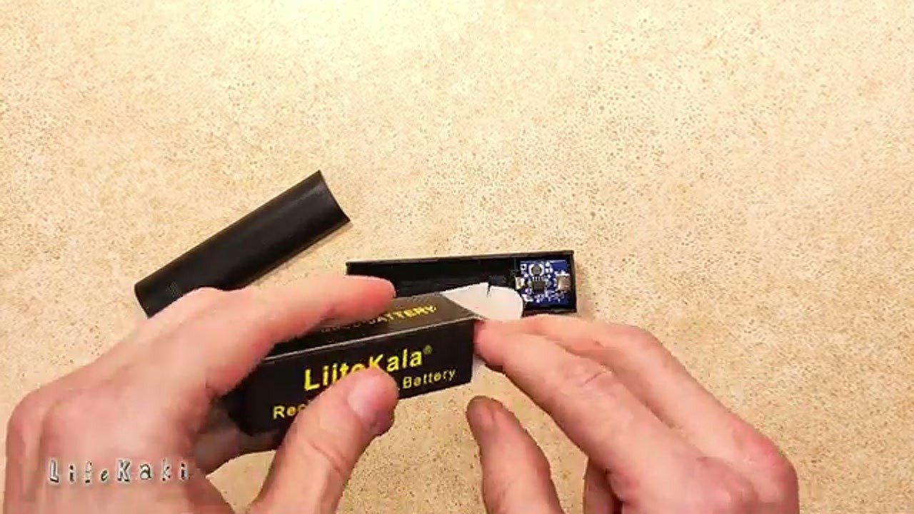 Inserting the 18650 battery into the power bank case