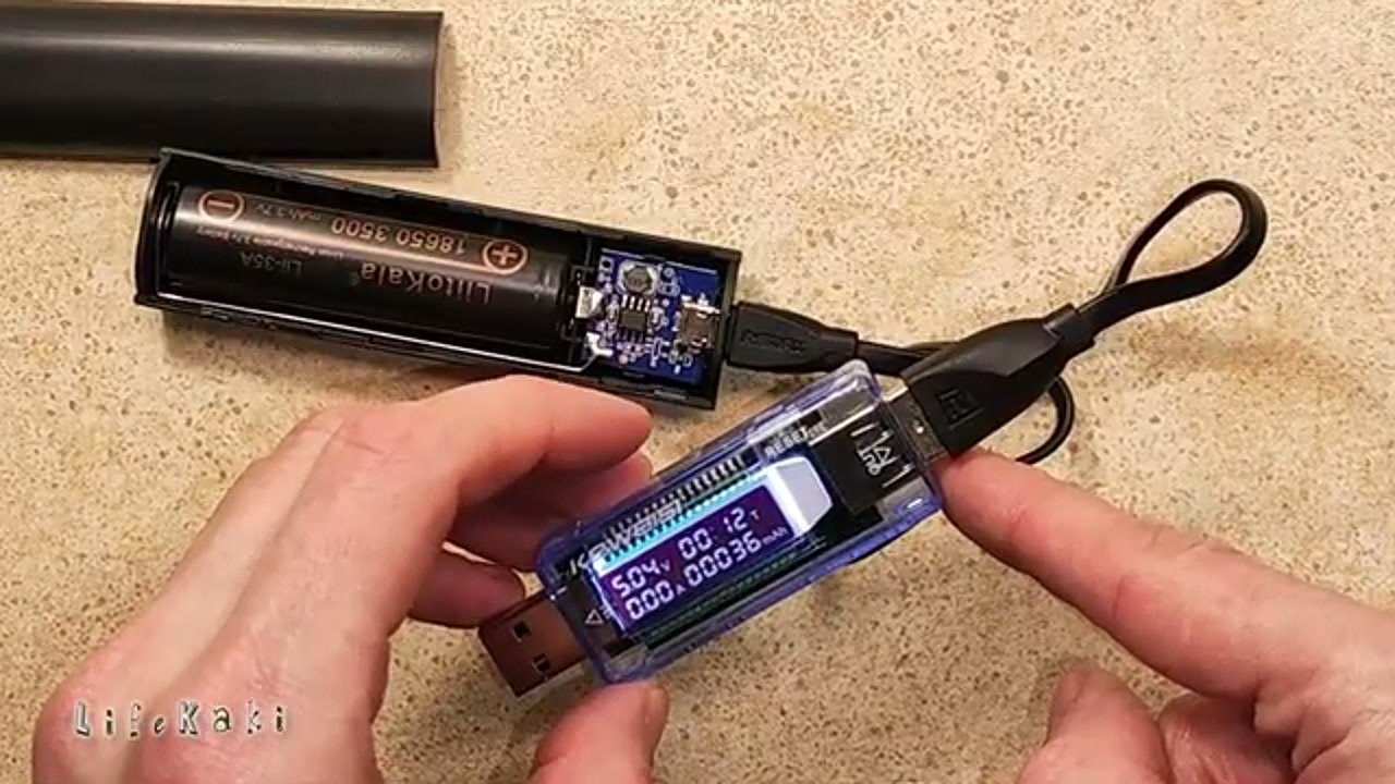 Multimeter displaying current and voltage readings