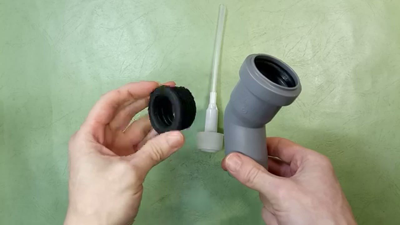 Fitting the black rubber connector to the pipe