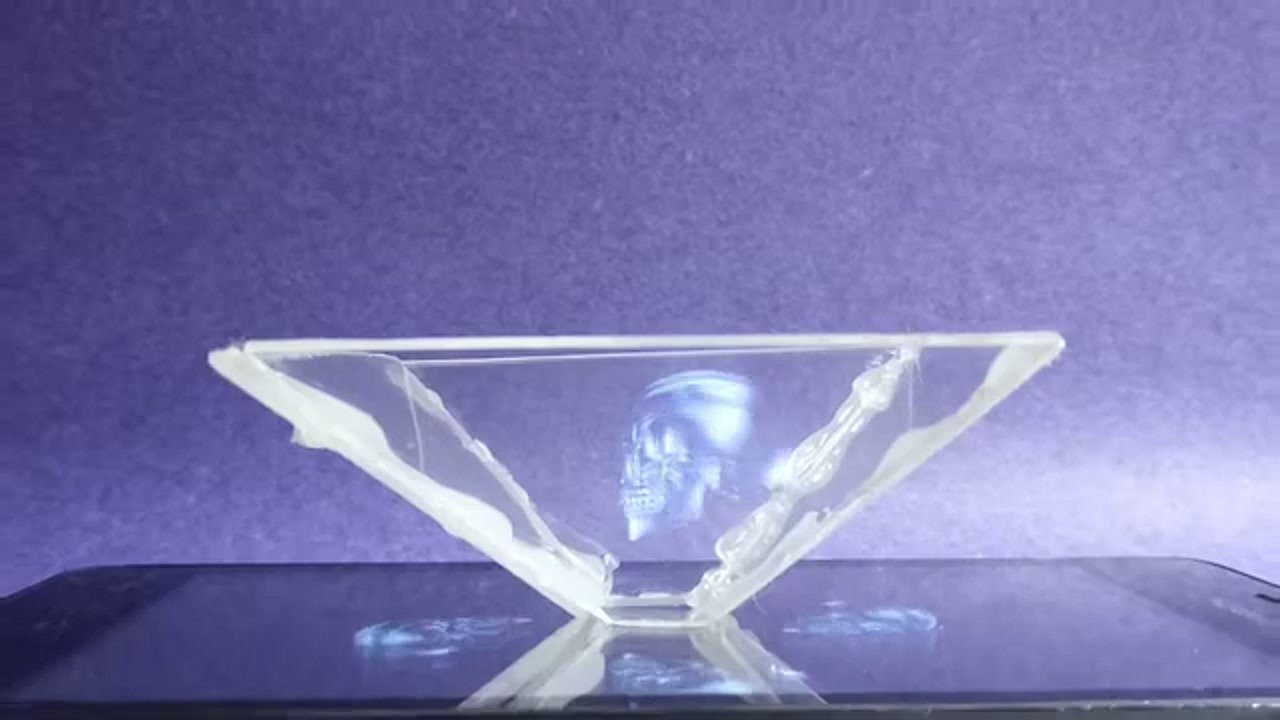 Testing the hologram projector with a skull graphic on a smartphone