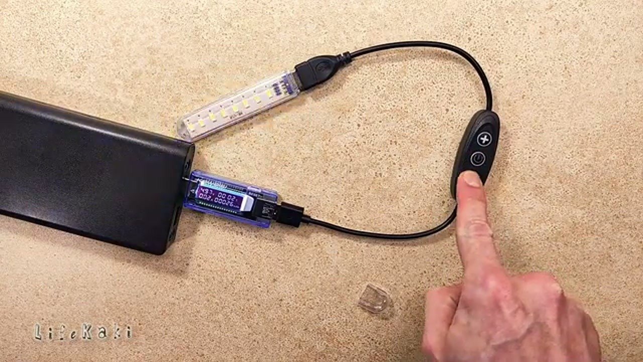 Hand pressing button on USB controller