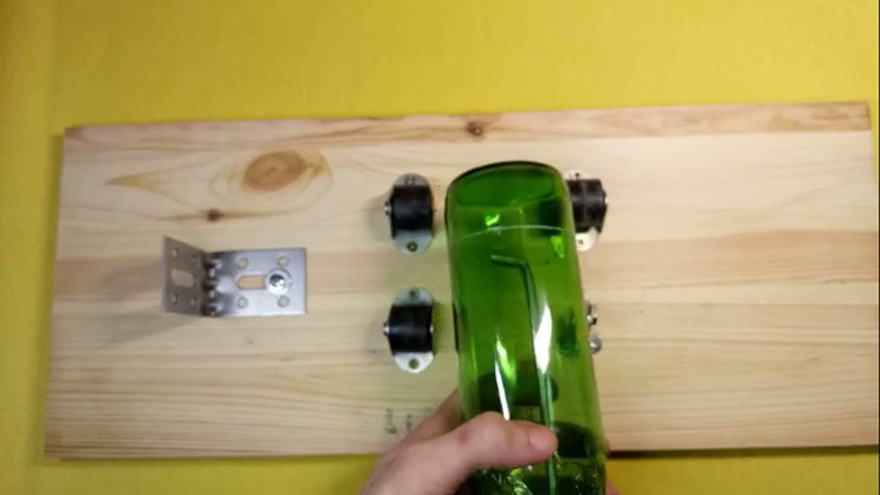 Separated pieces of a glass bottle after cutting