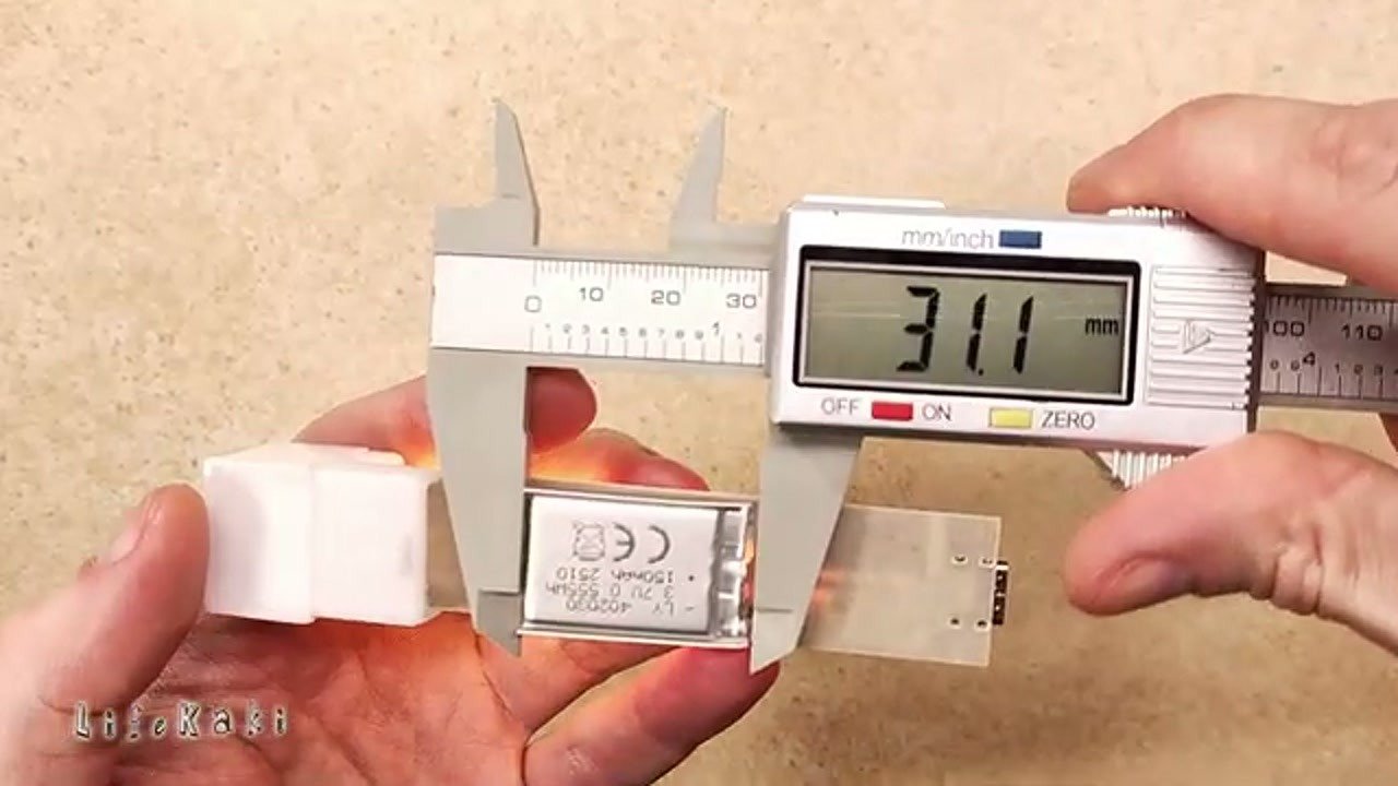 Measuring the internal battery compartment with calipers