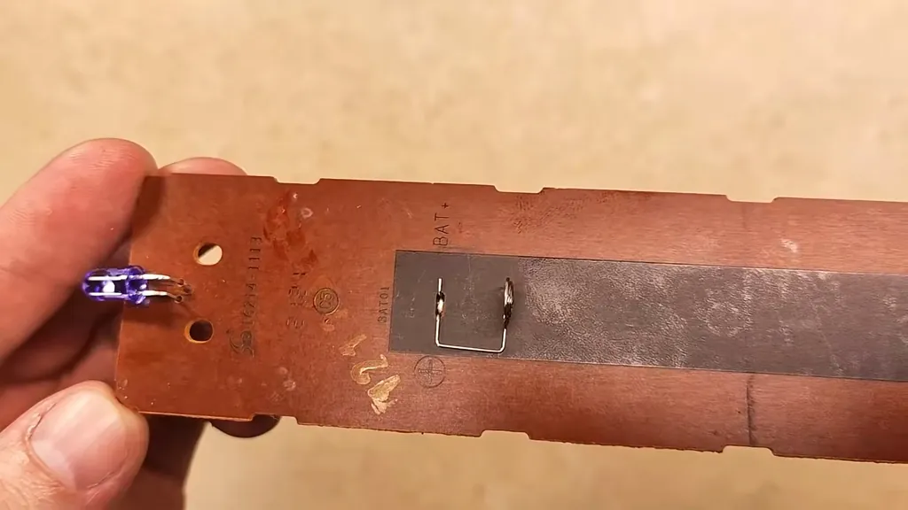 Scrubbing the rubber button pad with soap