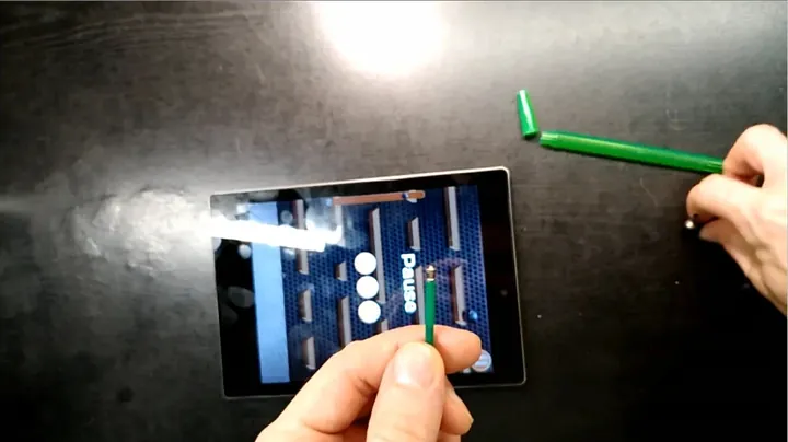 Pulling the plastic tool and extracted segment out of the port