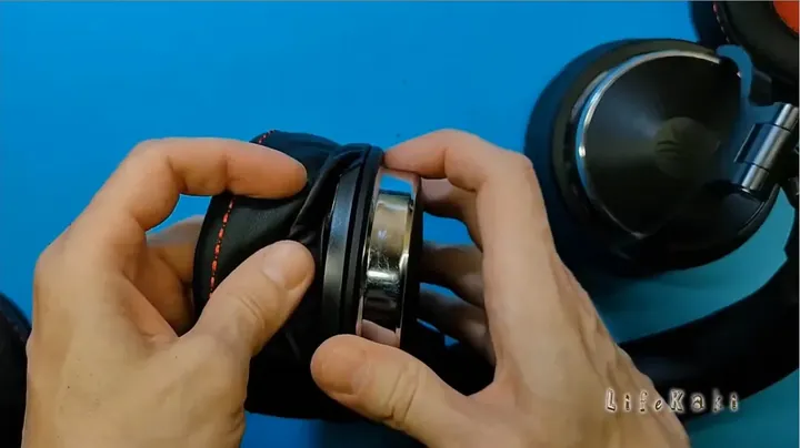 Installing the first replacement headphone ear cushion