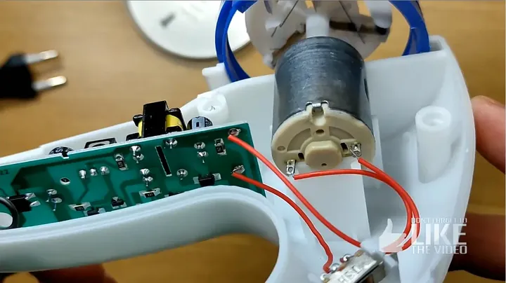 Clear close-up showing the motor and circuit board inside the device