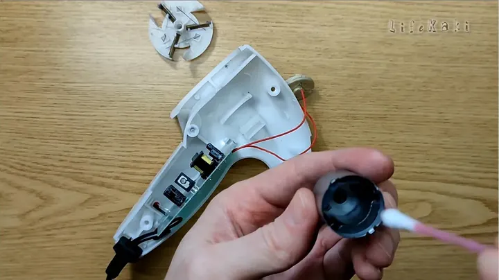 Cleaning internal parts of the motor with a cotton swab