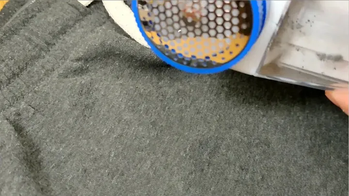 Testing the repaired fabric shaver on pilled fabric